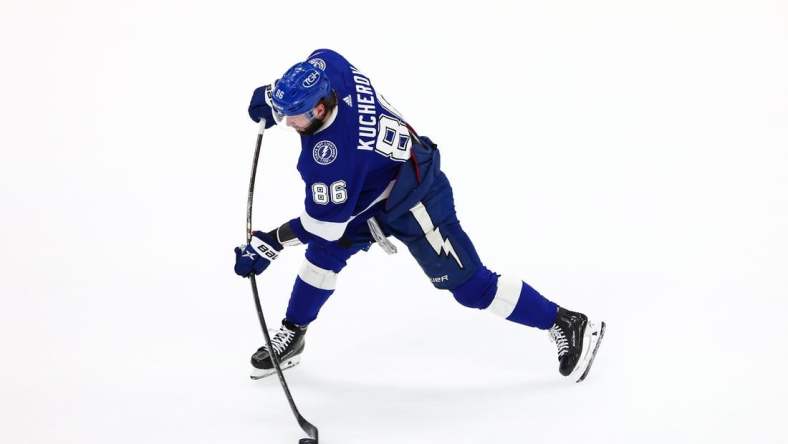 Jun 20, 2022; Tampa, Florida, USA; Tampa Bay Lightning right wing Nikita Kucherov (86) shoots against the Colorado Avalanche during the third period in game three of the 2022 Stanley Cup Final at Amalie Arena. Mandatory Credit: Mark J. Rebilas-USA TODAY Sports