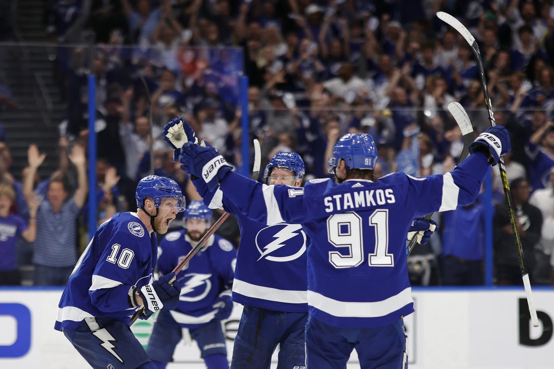 Jun 20, 2022; Tampa, Florida, USA; Tampa Bay Lightning right wing Corey Perry (10) celebrates with teammates after scoring a goal against the Colorado Avalanche in the second period in game three of the 2022 Stanley Cup Final at Amalie Arena. Mandatory Credit: Geoff Burke-USA TODAY Sports