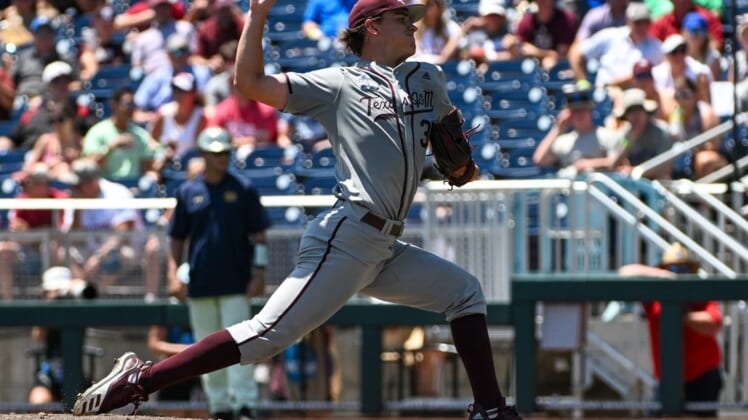 Jun 21, 2022; Omaha, NE, USA;  Texas A&M Aggies pitcher Nathan Dettmer (35) throws against the Notre Dame Fighting Irish in the first inning at Charles Schwab Field. Mandatory Credit: Steven Branscombe-USA TODAY Sports