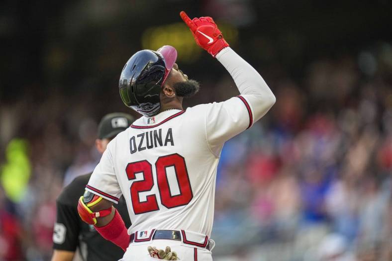 Jun 21, 2022; Cumberland, Georgia, USA; Atlanta Braves designated hitter Marcell Ozuna (20) reacts after hitting a two run home run against the San Francisco Giants during the second inning at Truist Park. Mandatory Credit: Dale Zanine-USA TODAY Sports