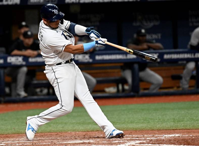 Jun 21, 2022; St. Petersburg, Florida, USA; Tampa Bay Rays first baseman Isaac Paredes (17) hits a two run home run in the fifth inning against the New York Yankees at Tropicana Field. Mandatory Credit: Jonathan Dyer-USA TODAY Sports