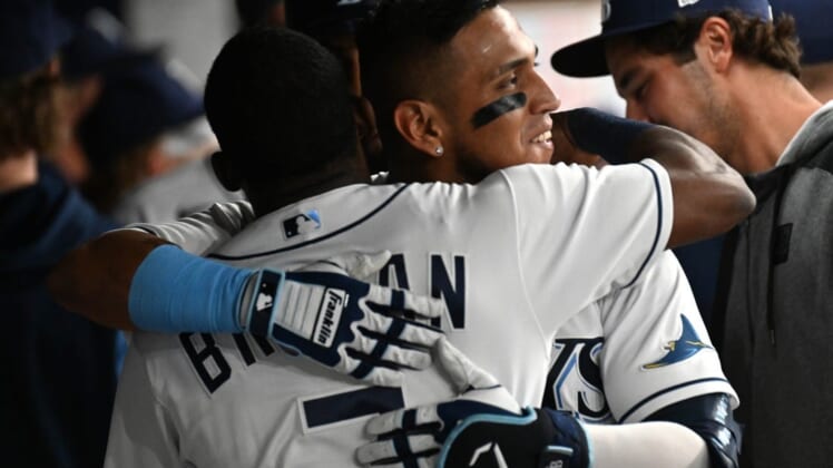 Jun 21, 2022; St. Petersburg, Florida, USA; Tampa Bay Rays first baseman Isaac Paredes (17) celebrates with  second baseman Vidal Brujan (7) after hitting a two run home run in the fifth inning against the New York Yankees at Tropicana Field. Mandatory Credit: Jonathan Dyer-USA TODAY Sports
