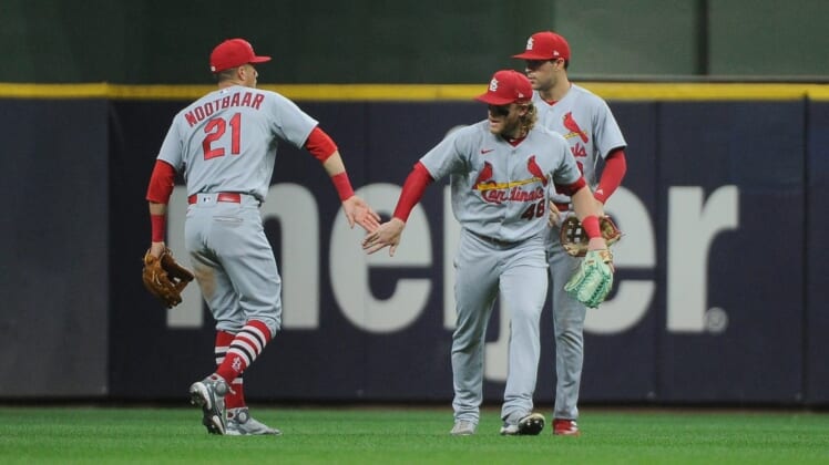 Jun 21, 2022; Milwaukee, Wisconsin, USA; St. Louis Cardinals center fielder Harrison Bader (48) and St. Louis Cardinals right fielder Lars Nootbaar (21) celebrate a 6-2 win against the Milwaukee Brewers at American Family Field. Mandatory Credit: Michael McLoone-USA TODAY Sports