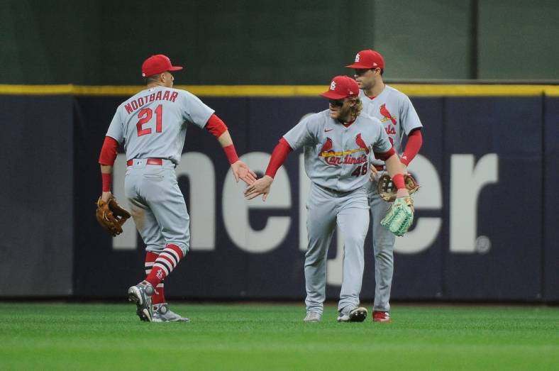 Jun 21, 2022; Milwaukee, Wisconsin, USA; St. Louis Cardinals center fielder Harrison Bader (48) and St. Louis Cardinals right fielder Lars Nootbaar (21) celebrate a 6-2 win against the Milwaukee Brewers at American Family Field. Mandatory Credit: Michael McLoone-USA TODAY Sports