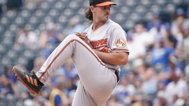 Jun 12, 2022; Kansas City, Missouri, USA; Baltimore Orioles starting pitcher Dean Kremer (64) delivers a pitch against the Kansas City Royals during the game at Kauffman Stadium. Mandatory Credit: Denny Medley-USA TODAY Sports