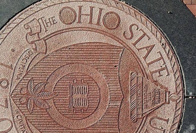 Ohio State University regularly uses the definitive article "The" in front of its name, as seen here in the university seal embedded in the pavement at the east entrance to the Oval on the main campus in Columbus.

The Ohio State University