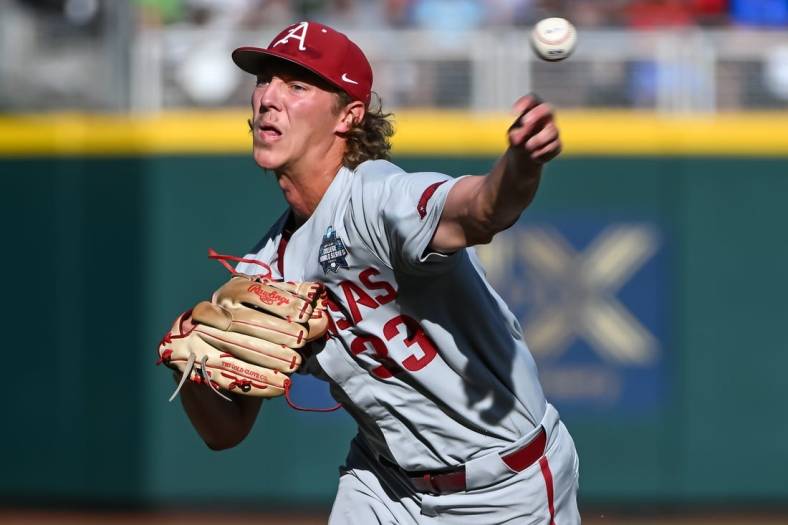 Jun 22, 2022; Omaha, NE, USA; Arkansas Razorbacks starting pitcher Hagen Smith (33) throws against the Ole Miss Rebels in the first inning at Charles Schwab Field. Mandatory Credit: Steven Branscombe-USA TODAY Sports