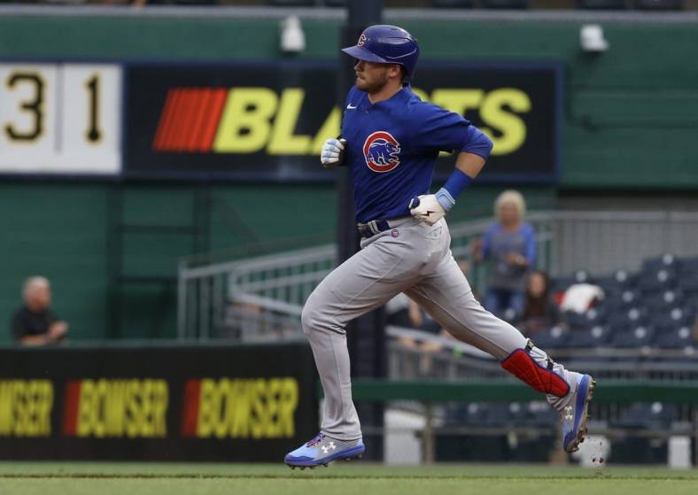 Jun 22, 2022; Pittsburgh, Pennsylvania, USA;  Chicago Cubs left fielder Ian Happ (8) circles the bases on a two-run home run against the Pittsburgh Pirates during the second inning at PNC Park. Mandatory Credit: Charles LeClaire-USA TODAY Sports