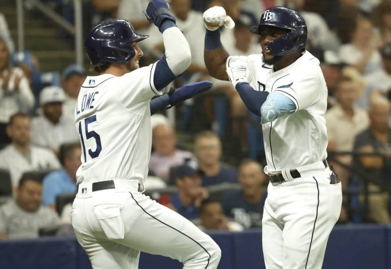Jun 22, 2022; St. Petersburg, Florida, USA; Tampa Bay Rays second baseman Vidal Brujan (7) is congratulated by  center fielder Josh Lowe (15) as he hits a two-run home run during the second inning against the New York Yankeesat Tropicana Field. Mandatory Credit: Kim Klement-USA TODAY Sports