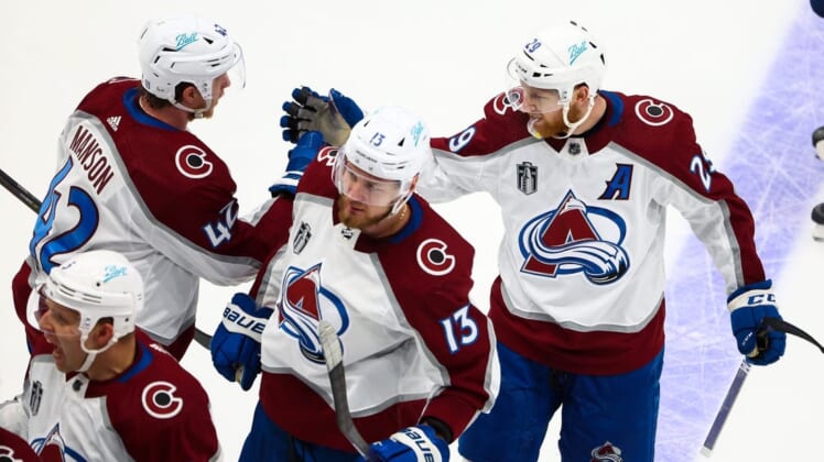 Jun 22, 2022; Tampa, Florida, USA; Colorado Avalanche center Nathan MacKinnon (29) celebrates with defenseman Josh Manson (42) after center Nazem Kadri (not pictured) scored the game winning goal against the Tampa Bay Lightning during overtime in game four of the 2022 Stanley Cup Final at Amalie Arena. Mandatory Credit: Mark J. Rebilas-USA TODAY Sports