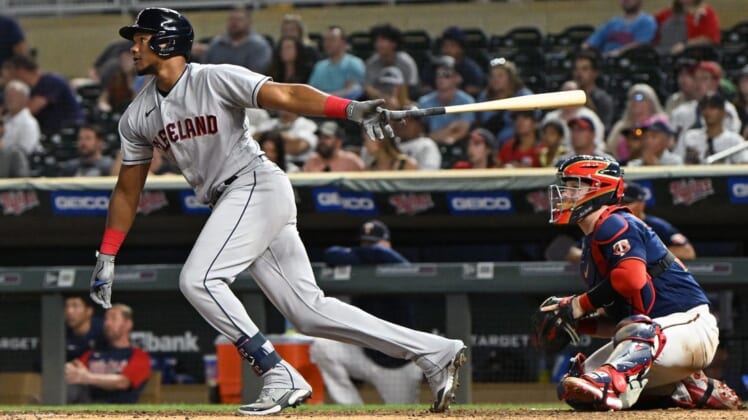 Jun 22, 2022; Minneapolis, Minnesota, USA; Cleveland Guardians outfielder Oscar Gonzalez (39) drives in two runs on a single against the Minnesota Twins during the ninth inning at Target Field. Mandatory Credit: Nick Wosika-USA TODAY Sports