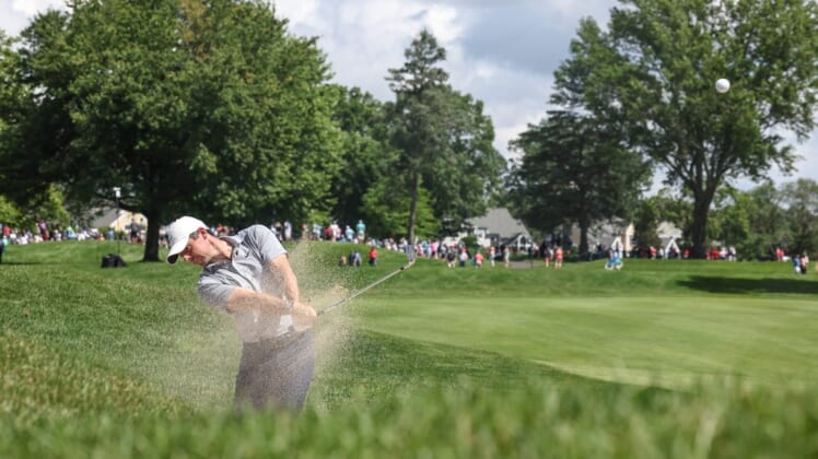 Jun 23, 2022; Cromwell, Connecticut, USA; Rory McIlroy plays a shot from a fairway bunker on the third hole during the first round of the Travelers Championship golf tournament. Mandatory Credit: Vincent Carchietta-USA TODAY Sports
