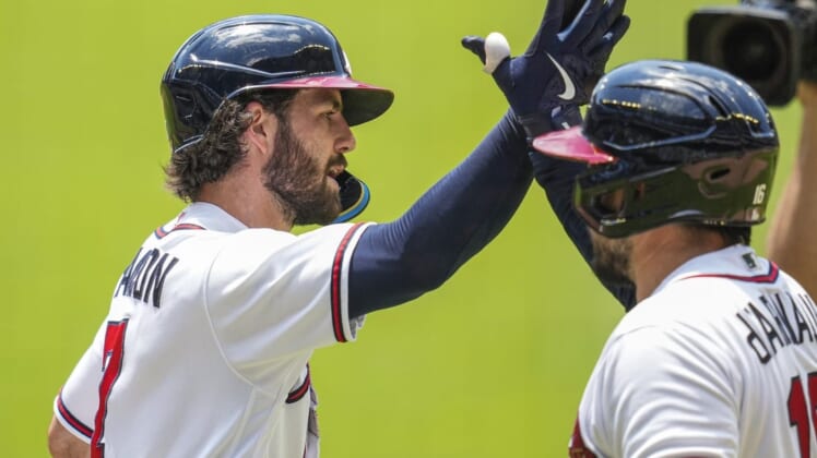 Jun 23, 2022; Cumberland, Georgia, USA; Atlanta Braves shortstop Dansby Swanson (7) reacts with catcher Travis d'Arnaud (16) after hitting a home run against the San Francisco Giants during the first inning at Truist Park. Mandatory Credit: Dale Zanine-USA TODAY Sports