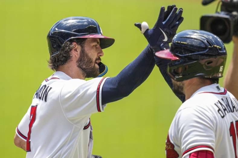 Jun 23, 2022; Cumberland, Georgia, USA; Atlanta Braves shortstop Dansby Swanson (7) reacts with catcher Travis d'Arnaud (16) after hitting a home run against the San Francisco Giants during the first inning at Truist Park. Mandatory Credit: Dale Zanine-USA TODAY Sports