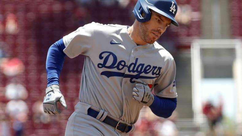 Jun 23, 2022; Cincinnati, Ohio, USA; Los Angeles Dodgers first baseman Freddie Freeman (5) runs the bases after hitting a two-run home run against the Cincinnati Reds during the third inning at Great American Ball Park. Mandatory Credit: David Kohl-USA TODAY Sports