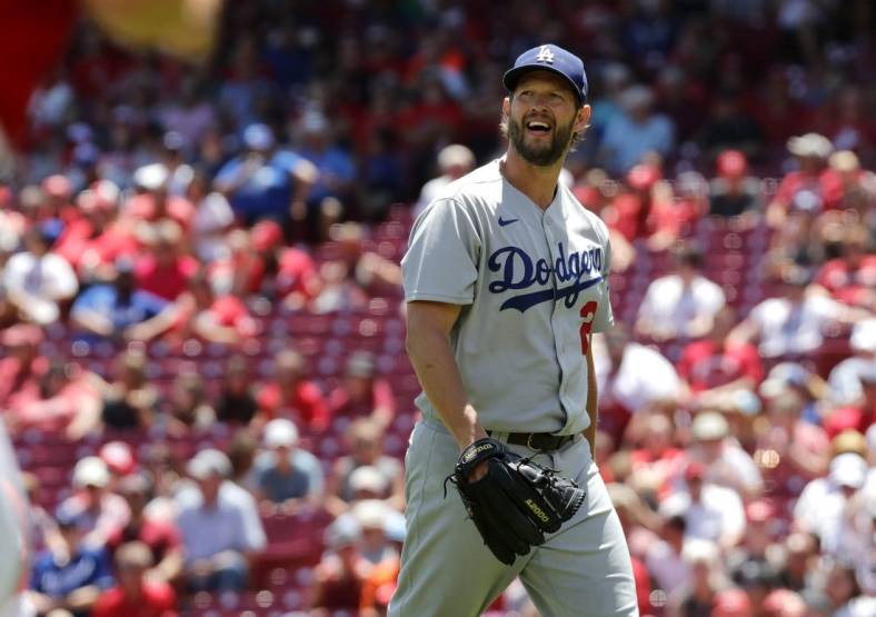 Jun 23, 2022; Cincinnati, Ohio, USA; Los Angeles Dodgers starting pitcher Clayton Kershaw (22) walks off the field during the sixth inning against the Cincinnati Reds at Great American Ball Park. Mandatory Credit: David Kohl-USA TODAY Sports