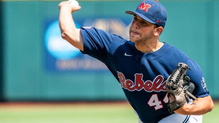 Jun 23, 2022; Omaha, NE, USA; Ole Miss Rebels starting pitcher Dylan DeLucia (44) pitches against the Arkansas Razorbacks during the first inning at Charles Schwab Field. Mandatory Credit: Dylan Widger-USA TODAY Sports