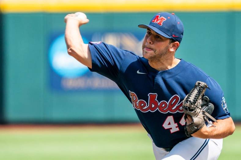 Jun 23, 2022; Omaha, NE, USA; Ole Miss Rebels starting pitcher Dylan DeLucia (44) pitches against the Arkansas Razorbacks during the first inning at Charles Schwab Field. Mandatory Credit: Dylan Widger-USA TODAY Sports