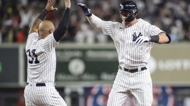 Jun 23, 2022; Bronx, New York, USA;  New York Yankees center fielder Aaron Judge (99) celebrates with left fielder Aaron Hicks (31) after hitting a game winning RBI single in the ninth inning to defeat the Houston Astros 7-6 at Yankee Stadium. Mandatory Credit: Wendell Cruz-USA TODAY Sports