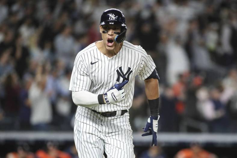 Jun 23, 2022; Bronx, New York, USA;  New York Yankees center fielder Aaron Judge (99) reacts after hitting a game winning RBI single in the ninth inning to defeat the Houston Astros 7-6 at Yankee Stadium. Mandatory Credit: Wendell Cruz-USA TODAY Sports