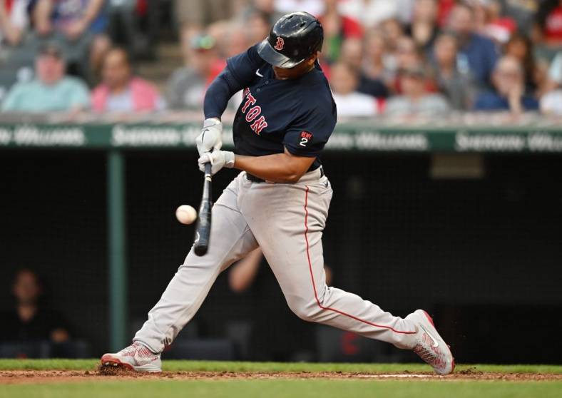 Jun 24, 2022; Cleveland, Ohio, USA; Boston Red Sox third baseman Rafael Devers (11) hits a double during the fifth inning against the Cleveland Guardians at Progressive Field. Mandatory Credit: Ken Blaze-USA TODAY Sports