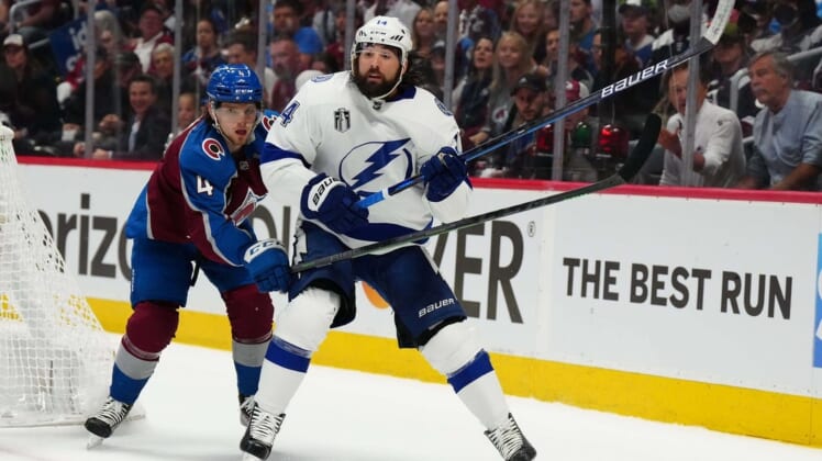 Jun 24, 2022; Denver, Colorado, USA; Colorado Avalanche defenseman Bowen Byram (4) defends against Tampa Bay Lightning left wing Pat Maroon (14) during the first period in game five of the 2022 Stanley Cup Final at Ball Arena. Mandatory Credit: Ron Chenoy-USA TODAY Sports