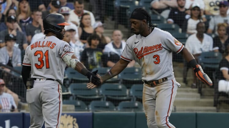 Jun 24, 2022; Chicago, Illinois, USA; Baltimore Orioles shortstop baseman Jorge Mateo (3) is greeted by center fielder Cedric Mullins (31) after scoring against the Chicago White Sox during the second inning at Guaranteed Rate Field. Mandatory Credit: David Banks-USA TODAY Sports