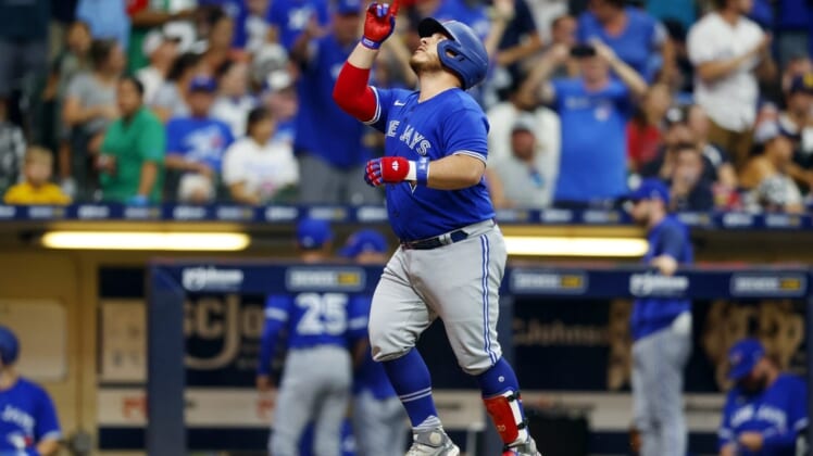 Jun 24, 2022; Milwaukee, Wisconsin, USA;  Toronto Blue Jays catcher Alejandro Kirk (30) celebrates after hitting a home run during the seventh inning against the Milwaukee Brewers at American Family Field. Mandatory Credit: Jeff Hanisch-USA TODAY Sports