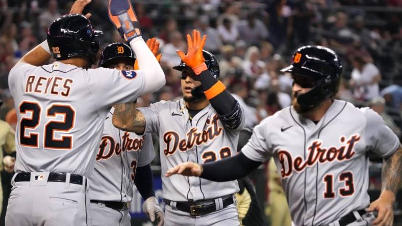 Jun 24, 2022; Phoenix, Arizona, USA; Detroit Tigers shortstop Javier Baez (28) celebrates with teammates after hitting a grand run against the Arizona Diamondbacks during the third inning at Chase Field. Mandatory Credit: Joe Camporeale-USA TODAY Sports