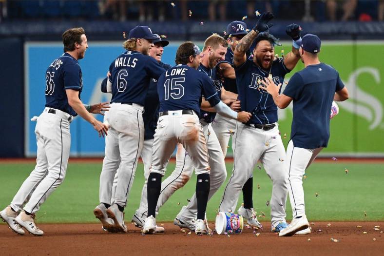 Jun 24, 2022; St. Petersburg, Florida, USA; Tampa Bay Rays pinch hitter Harold Ramirez (43) celebrates with his teammates after getting the game winning hit against the Pittsburg Pirates at Tropicana Field. Mandatory Credit: Jonathan Dyer-USA TODAY Sports