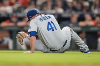 Jun 24, 2022; Cumberland, Georgia, USA; Los Angeles Dodgers relief pitcher Daniel Hudson (41) reacts after being injured against the Atlanta Braves during the eighth inning at Truist Park. Mandatory Credit: Dale Zanine-USA TODAY Sports