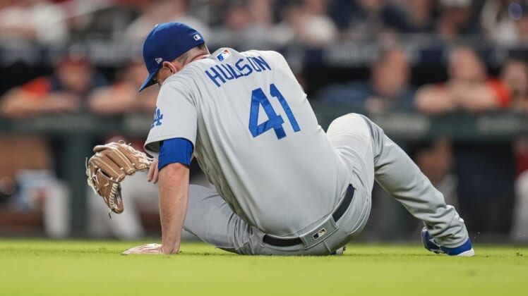 Jun 24, 2022; Cumberland, Georgia, USA; Los Angeles Dodgers relief pitcher Daniel Hudson (41) reacts after being injured against the Atlanta Braves during the eighth inning at Truist Park. Mandatory Credit: Dale Zanine-USA TODAY Sports