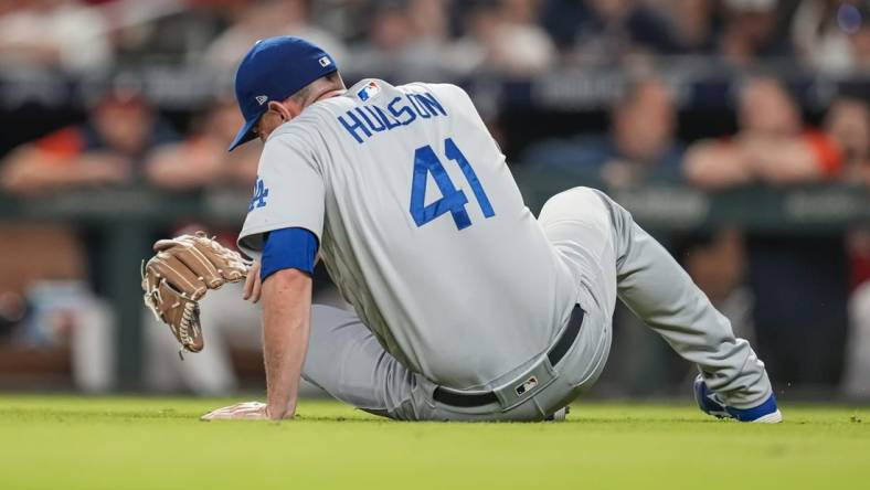 Jun 24, 2022; Cumberland, Georgia, USA; Los Angeles Dodgers relief pitcher Daniel Hudson (41) reacts after being injured against the Atlanta Braves during the eighth inning at Truist Park. Mandatory Credit: Dale Zanine-USA TODAY Sports