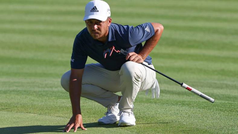 Jun 25, 2022; Cromwell, Connecticut, USA; Xander Schauffele looks over a putt on the 18th green during the third round of the Travelers Championship golf tournament. Mandatory Credit: Vincent Carchietta-USA TODAY Sports