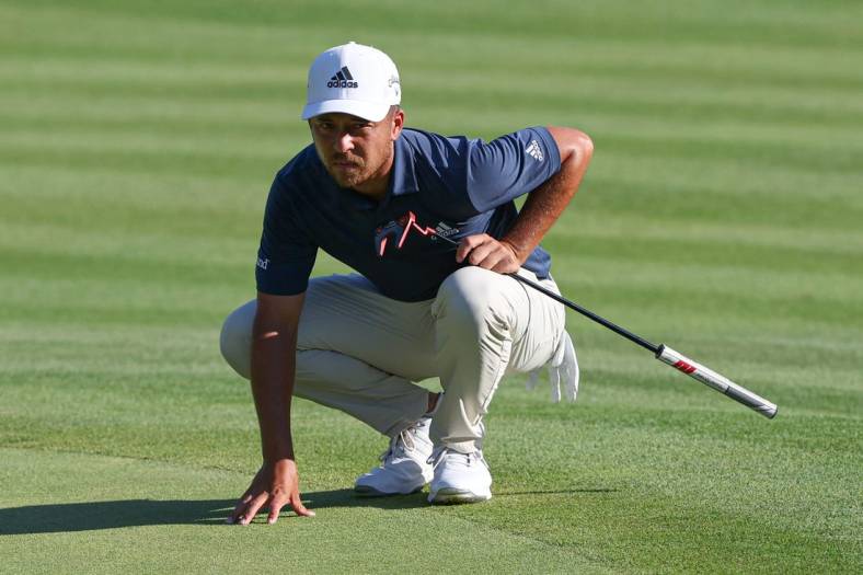 Jun 25, 2022; Cromwell, Connecticut, USA; Xander Schauffele looks over a putt on the 18th green during the third round of the Travelers Championship golf tournament. Mandatory Credit: Vincent Carchietta-USA TODAY Sports