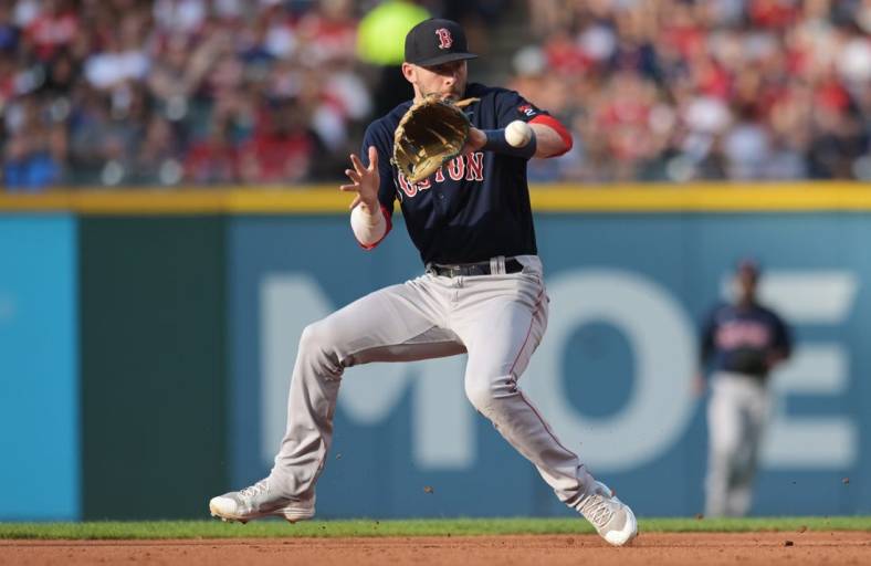 Jun 25, 2022; Cleveland, Ohio, USA; Boston Red Sox second baseman Trevor Story (10) fields a ball hit by Cleveland Guardians first baseman Owen Miller (not pictured) during the fourth inning at Progressive Field. Mandatory Credit: Ken Blaze-USA TODAY Sports