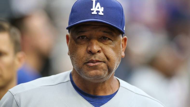 Jun 25, 2022; Atlanta, Georgia, USA; Los Angeles Dodgers manager Dave Roberts (30) in the dugout before a game against the Atlanta Braves at Truist Park. Mandatory Credit: Brett Davis-USA TODAY Sports