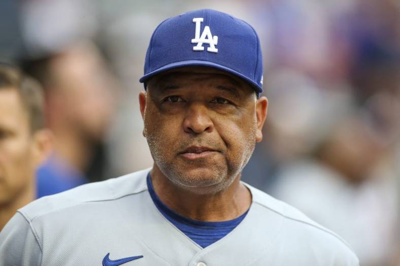 Jun 25, 2022; Atlanta, Georgia, USA; Los Angeles Dodgers manager Dave Roberts (30) in the dugout before a game against the Atlanta Braves at Truist Park. Mandatory Credit: Brett Davis-USA TODAY Sports