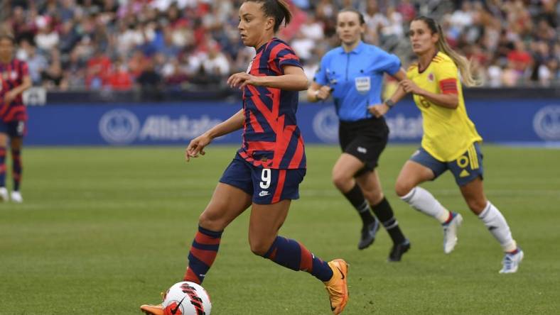 Jun 25, 2022; Commerce City, Colorado, USA; USA forward Mallory Pugh (9) brings the ball up field against Colombia during an international friendly soccer match at Dick's Sporting Goods Park. Mandatory Credit: John Leyba-USA TODAY Sports