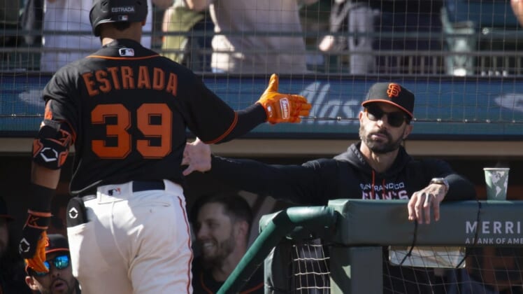 Jun 25, 2022; San Francisco, California, USA; San Francisco Giants manager Gabe Kapler (right) greets Thairo Estrada (39) after he hit a solo home run against the Cincinnati Reds during the second inning at Oracle Park. Mandatory Credit: D. Ross Cameron-USA TODAY Sports