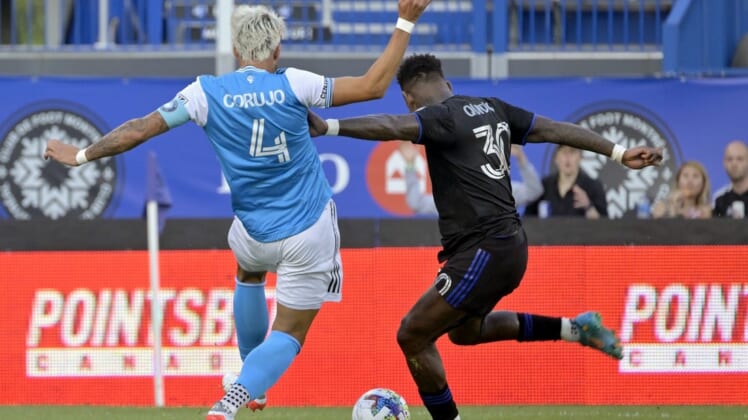 Jun 25, 2022; Montreal, Quebec, CAN; CF Montreal midfielder Romell Quioto (30) scores a goal against Charlotte FC during the first half at Stade Saputo. Mandatory Credit: Eric Bolte-USA TODAY Sports