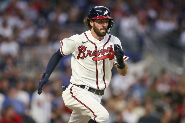 Jun 25, 2022; Atlanta, Georgia, USA; Atlanta Braves shortstop Dansby Swanson (7) runs to first base after hitting a single against the Los Angeles Dodgers in the fifth inning at Truist Park. Mandatory Credit: Brett Davis-USA TODAY Sports