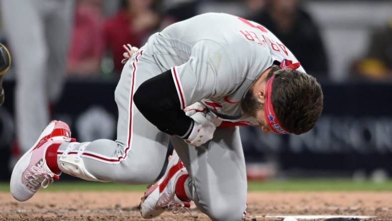 Jun 25, 2022; San Diego, California, USA; Philadelphia Phillies designated hitter Bryce Harper (3) reacts after being hit by a pitch during the fourth inning against the San Diego Padres at Petco Park. Mandatory Credit: Orlando Ramirez-USA TODAY Sports