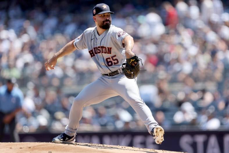 Jun 26, 2022; Bronx, New York, USA; Houston Astros starting pitcher Jose Urquidy (65) pitches against the New York Yankees during the first inning at Yankee Stadium. Mandatory Credit: Brad Penner-USA TODAY Sports