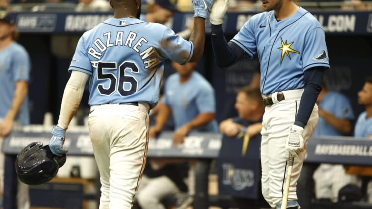 Jun 26, 2022; St. Petersburg, Florida, USA;  Tampa Bay Rays right fielder Randy Arozarena (56) is congratulated by  center fielder Josh Lowe (15) after he scores a run against the Pittsburgh Pirates during the seventh inning at Tropicana Field. Mandatory Credit: Kim Klement-USA TODAY Sports