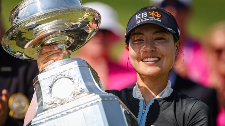 Jun 26, 2022; Bethesda, Maryland, USA; In Gee Chun holds the trophy after wining the KPMG Women's PGA Championship golf tournament at Congressional Country Club. Mandatory Credit: Scott Taetsch-USA TODAY Sports