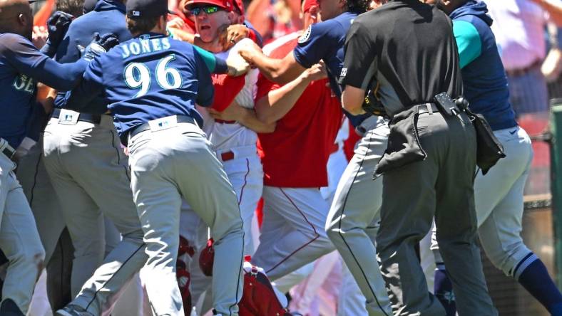 Jun 26, 2022; Anaheim, California, USA;  The Los Angeles Angels and Seattle Mariners cleared the benched during a brawl in the second inning at Angel Stadium. Mandatory Credit: Jayne Kamin-Oncea-USA TODAY Sports