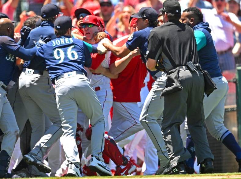 Jun 26, 2022; Anaheim, California, USA;  The Los Angeles Angels and Seattle Mariners cleared the benched during a brawl in the second inning at Angel Stadium. Mandatory Credit: Jayne Kamin-Oncea-USA TODAY Sports