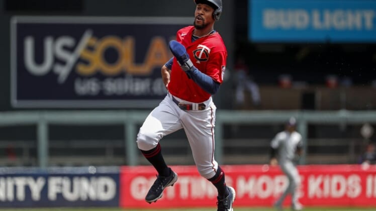 Jun 26, 2022; Minneapolis, Minnesota, USA; Minnesota Twins designated hitter Byron Buxton (25) runs to third from first on a single by Carlos Correa (not pictured) against the Colorado Rockies in the first inning at Target Field. Mandatory Credit: Bruce Kluckhohn-USA TODAY Sports