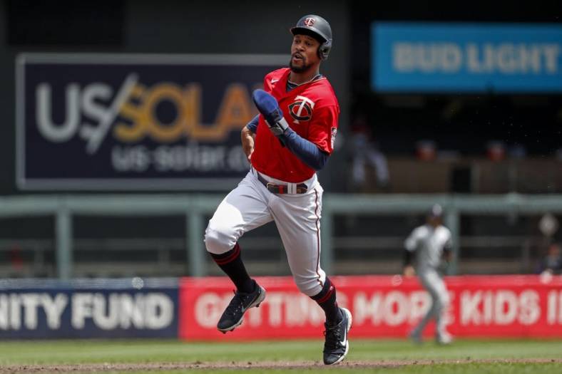 Jun 26, 2022; Minneapolis, Minnesota, USA; Minnesota Twins designated hitter Byron Buxton (25) runs to third from first on a single by Carlos Correa (not pictured) against the Colorado Rockies in the first inning at Target Field. Mandatory Credit: Bruce Kluckhohn-USA TODAY Sports